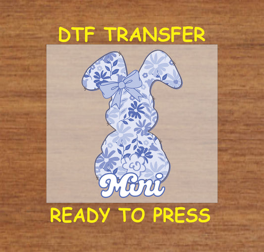 Blue floral Easter bunny DTF transfer with "Mini" text and a bow.