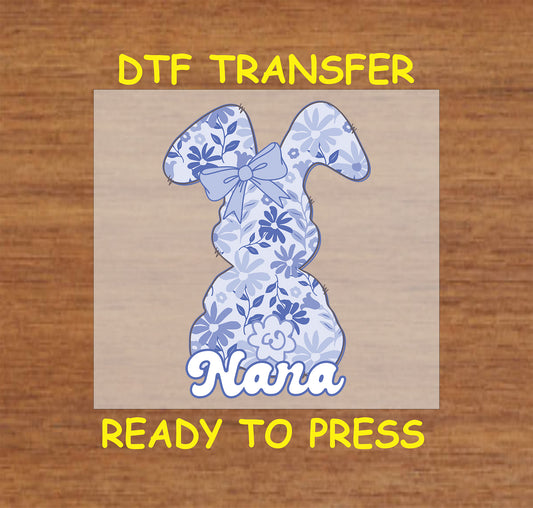 Blue floral Easter bunny DTF transfer with "Nana" text and a bow.