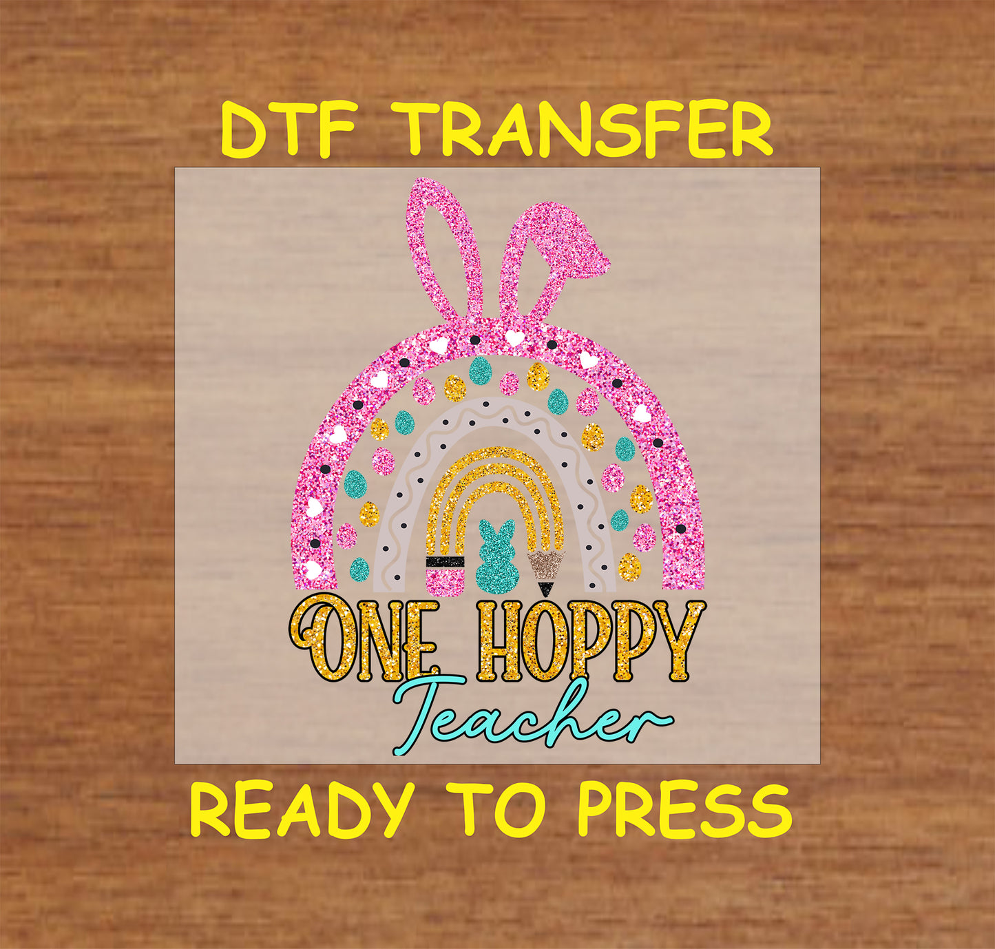 One Hoppy Teacher DTF transfer with a glittery rainbow, bunny ears, and pastel details.