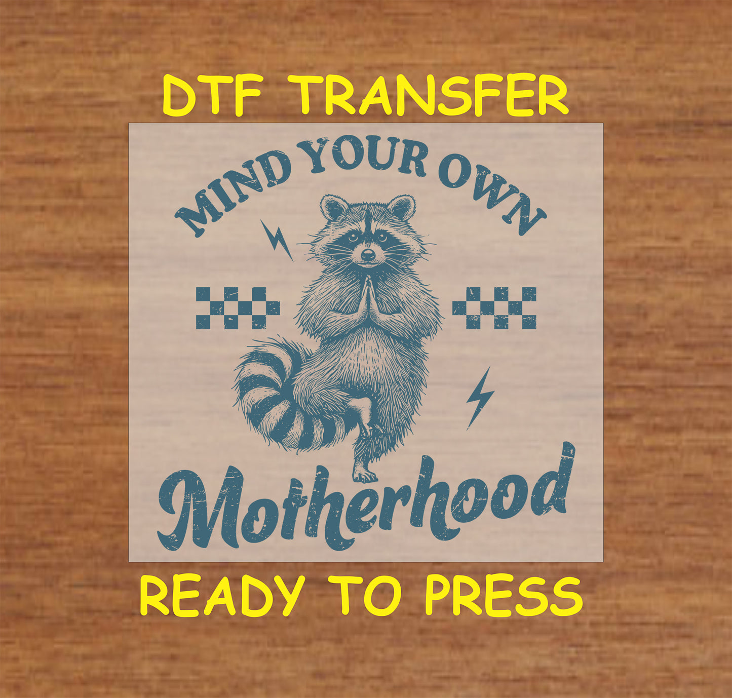 Mind Your Own Motherhood DTF transfer with a meditating raccoon, retro checkers, and lightning bolts.