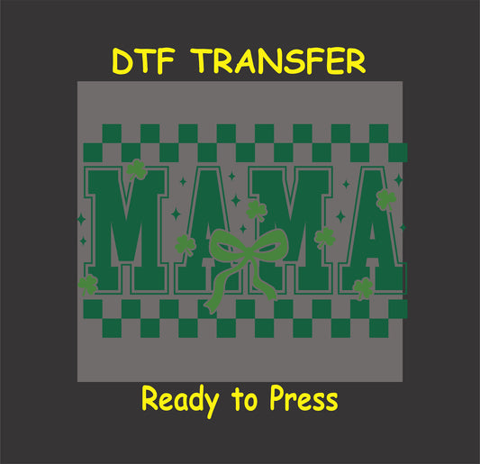 Green St. Patrick’s Day DTF transfer with "MAMA" text, shamrocks, checkerboard pattern, and bow.