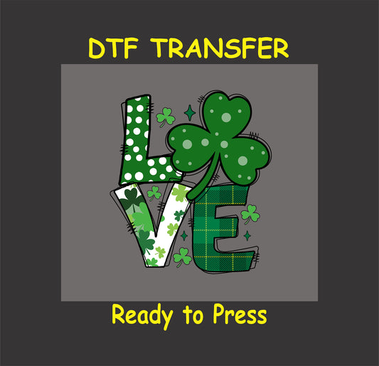 St. Patrick’s Day DTF transfer with "LOVE" text, shamrock, plaid, and clovers.