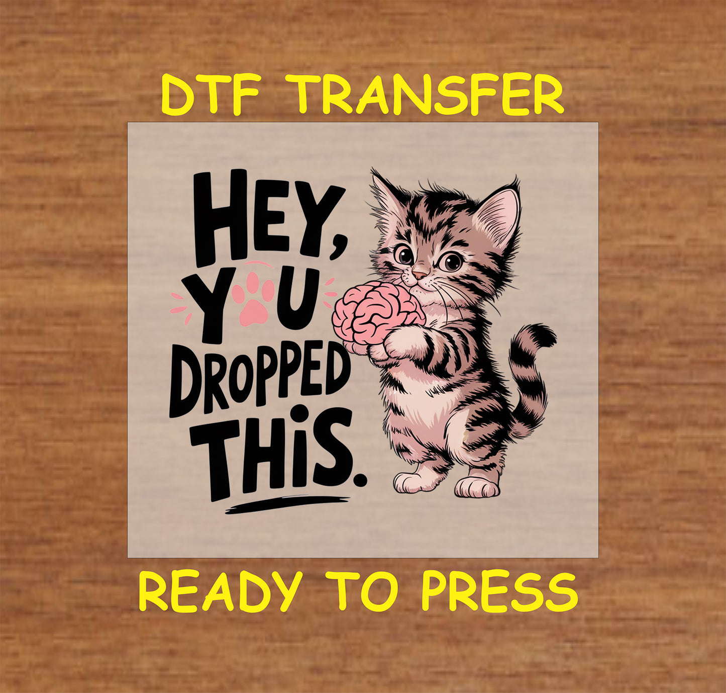 Funny cat DTF transfer with a kitten holding a brain and the phrase "Hey, You Dropped This."