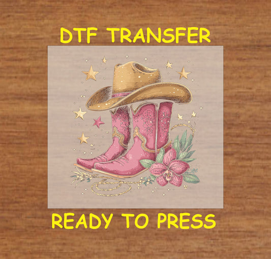 Pink cowboy boots with a cowboy hat, floral accents, and stars.