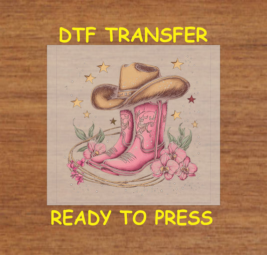 Pink cowgirl boots with a cowboy hat, floral accents, rope, and stars.