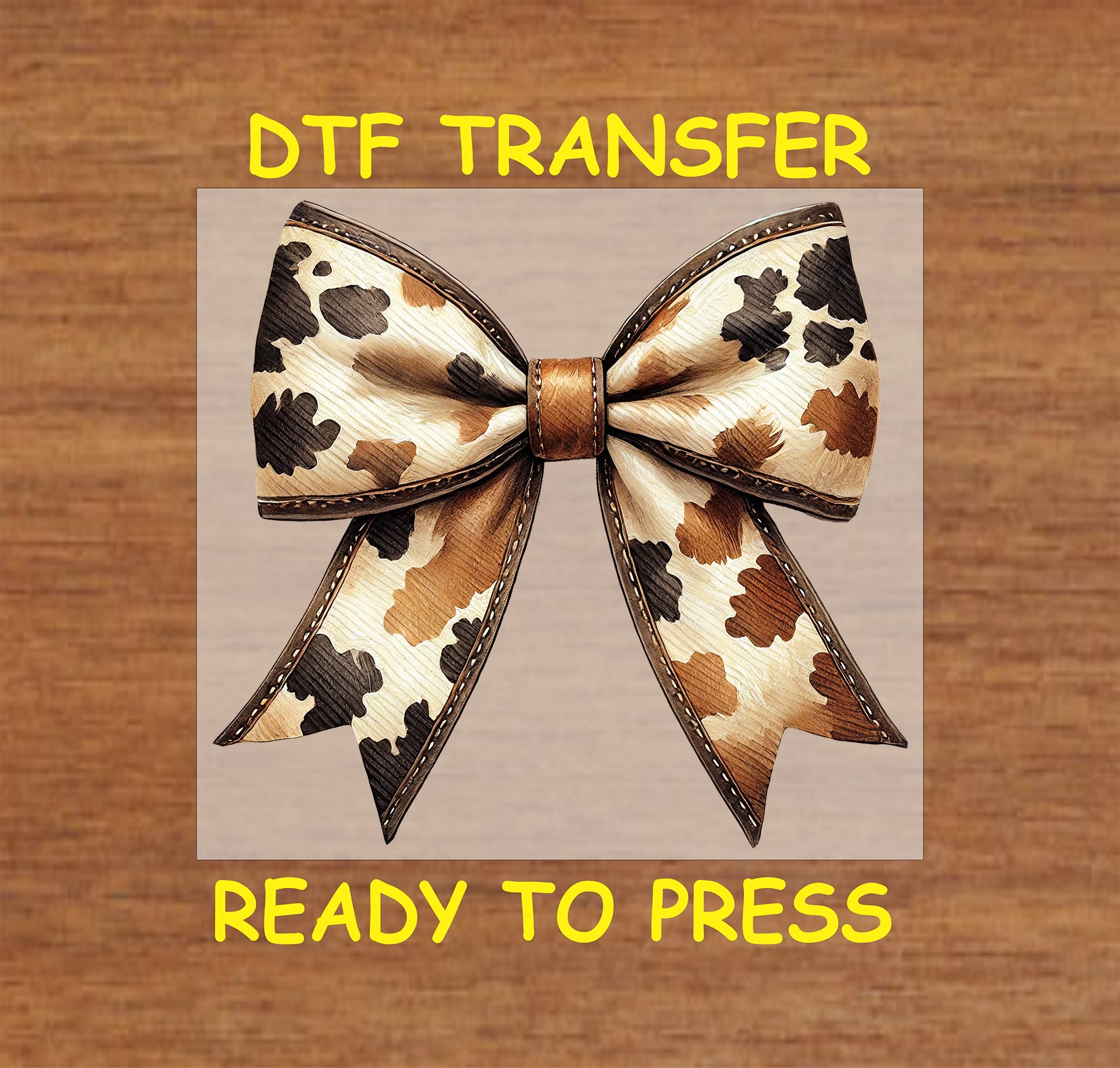 Cow print bow with leather-textured accents and stitched details.