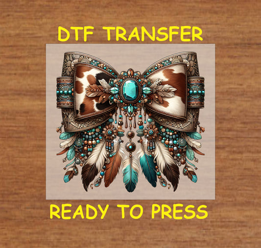 Western DTF transfer with cow print bow, turquoise gemstones, and feather details.