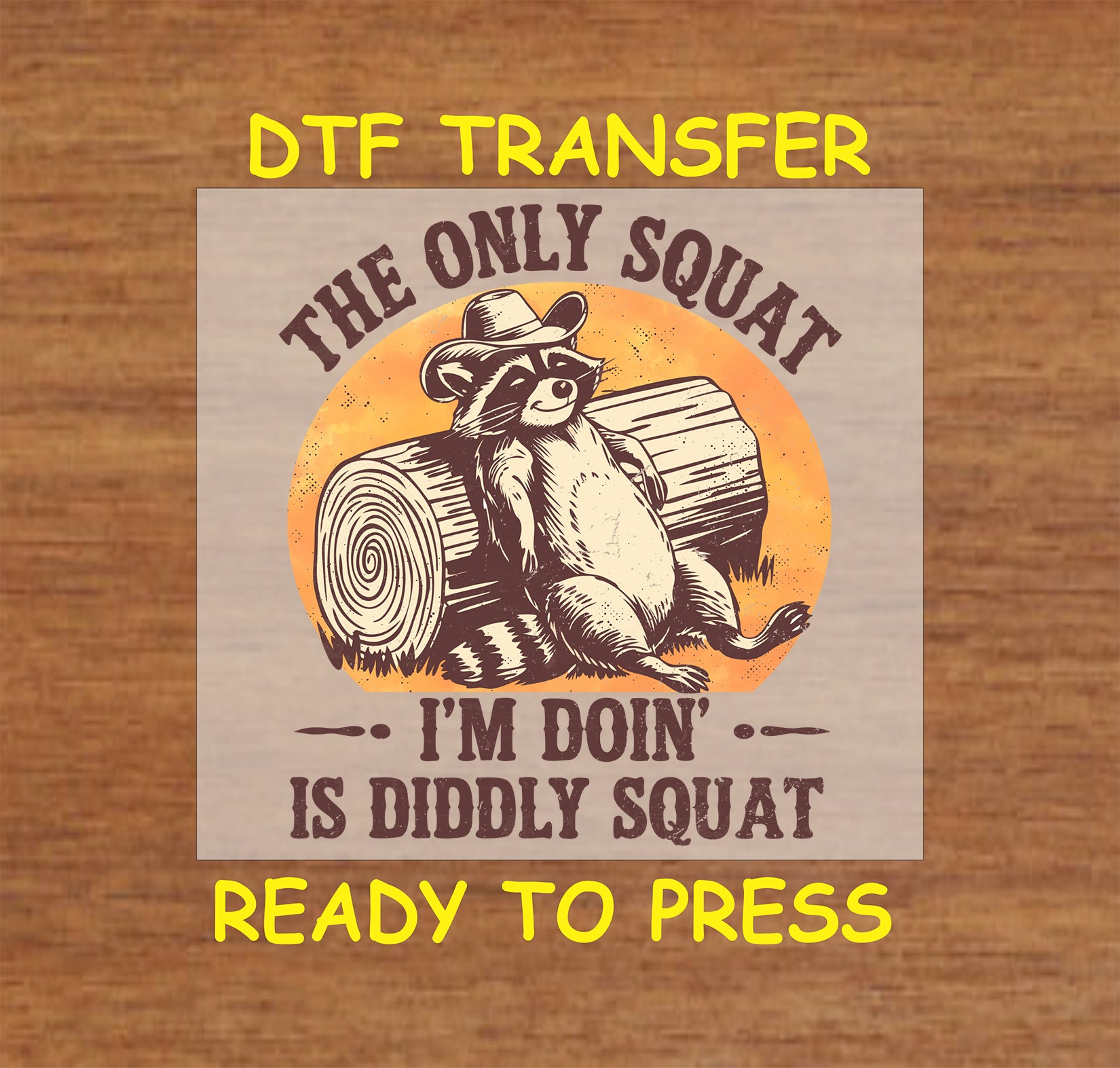 Western DTF transfer featuring a raccoon in a cowboy hat lounging on a log with a humorous quote.