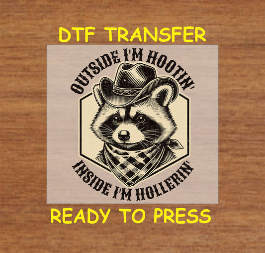 Western DTF transfer featuring a raccoon in a cowboy hat with the phrase "Outside I'm Hootin', Inside I'm Hollerin'."
