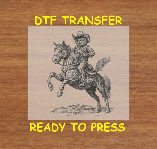 Black and white cowboy cat DTF transfer featuring a cat riding a horse in full western attire.