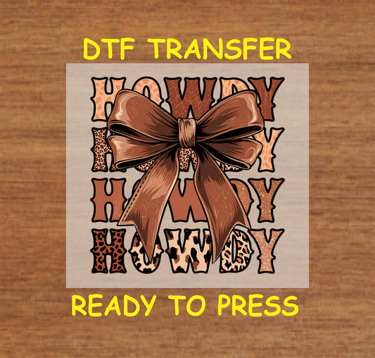 Howdy DTF transfer with western leopard print text and a brown bow.