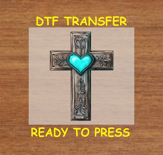 Western cross DTF transfer with engraved details and a turquoise heart in the center.