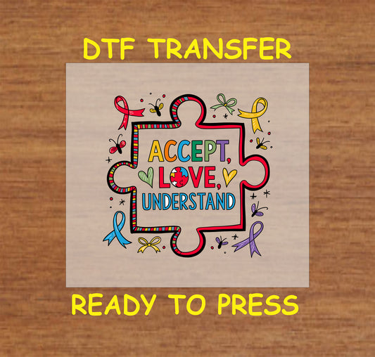 Puzzle piece with “Accept Love Understand” text surrounded by awareness ribbons and butterflies