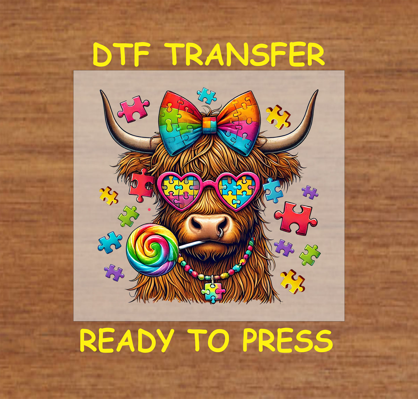 Highland cow with rainbow puzzle bow, heart glasses, and lollipop surrounded by puzzle pieces.