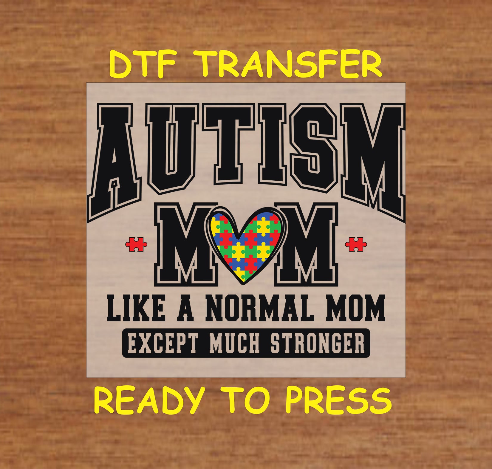 DTF transfer with "Autism Mom" quote and puzzle heart design.