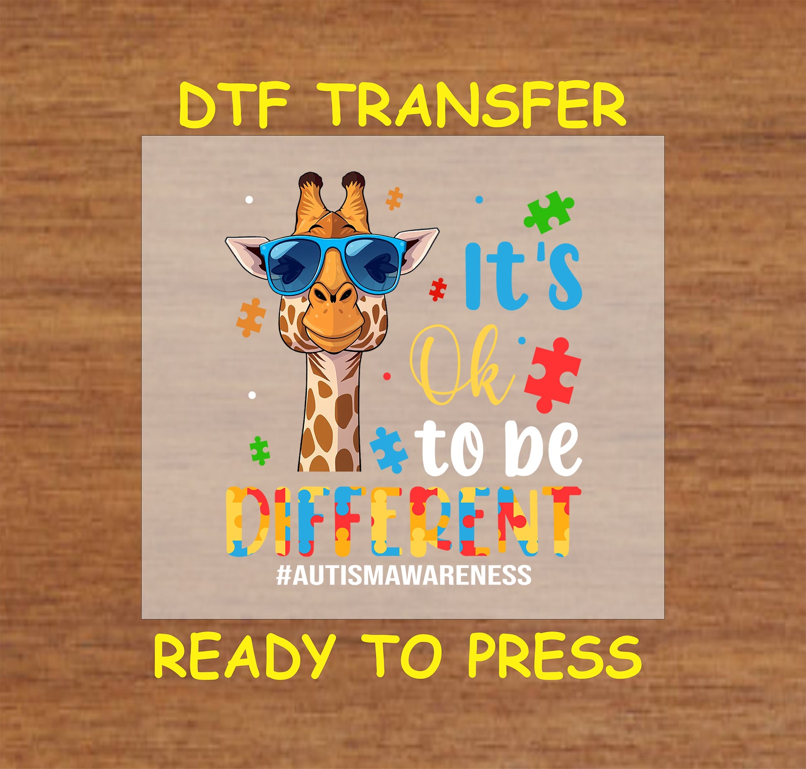 Giraffe autism DTF transfer with “It’s Ok to Be Different” quote.