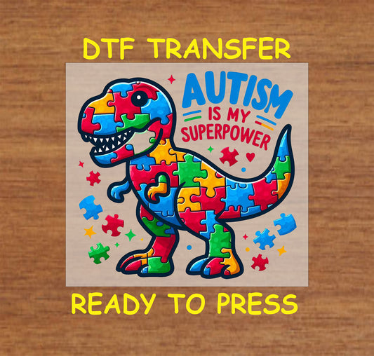 Colorful puzzle dinosaur with “Autism Is My Superpower” text.