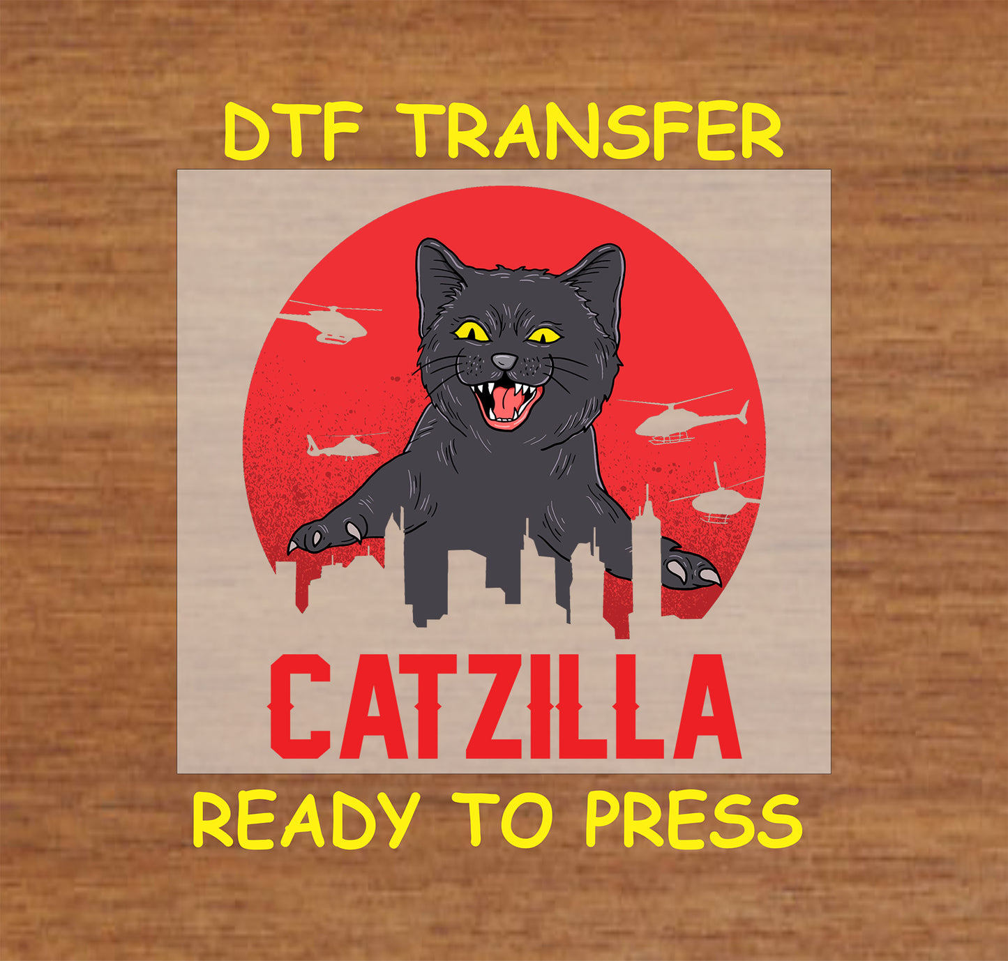 DTF transfer with black cat towering over city skyline and red sun background, labeled “Catzilla”