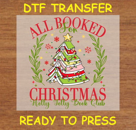 "All Booked for Christmas DTF Transfer featuring a Christmas tree made of books with festive lights and holiday lettering"