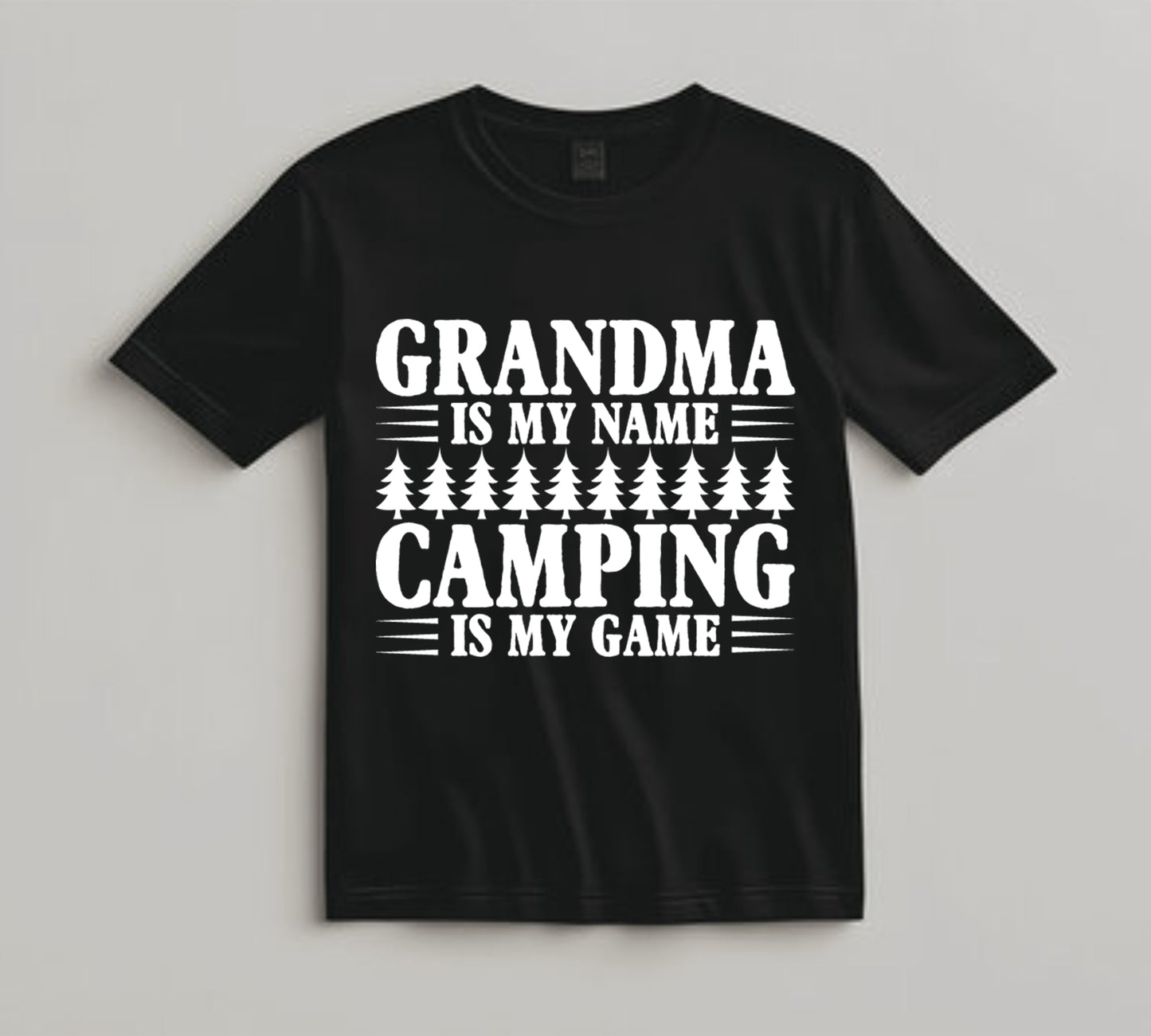 White DTF transfer with the phrase "Grandma Is My Name, Camping Is My Game" and pine trees.