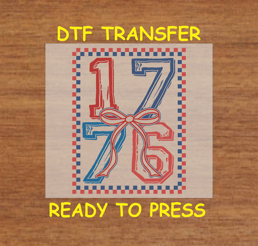 1776 DTF transfer with red and blue numbers, bow accent, and patriotic border.