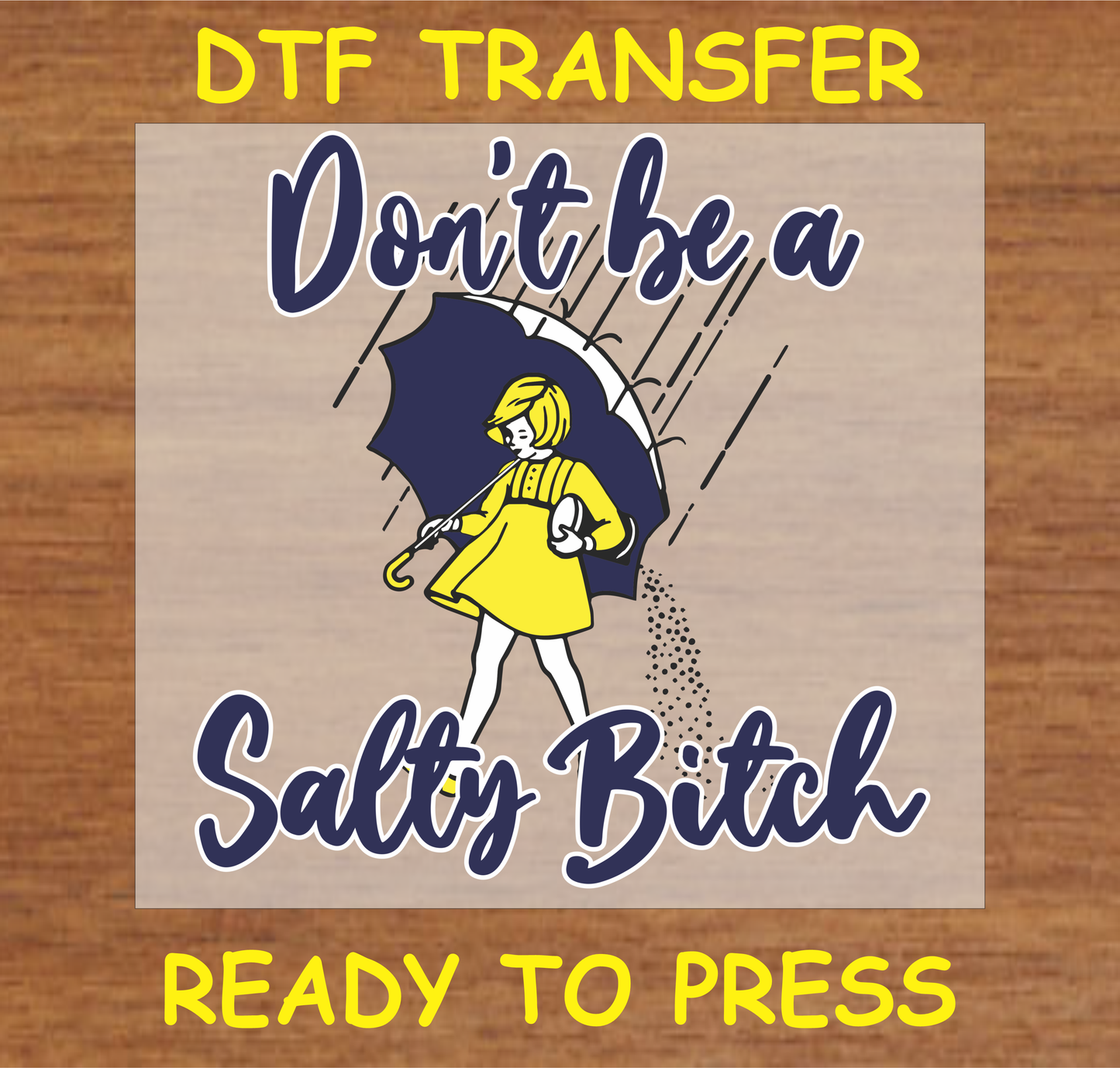 DTF transfer with the text 'Don't Be a Salty Bi$$$' and a character holding an umbrella, featuring bold colors and a playful design.