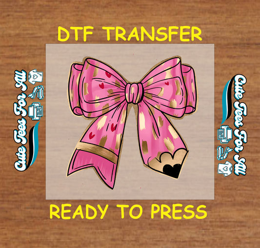 DTF transfer with pink bow, gold brush accents, and pencil tip with heart.