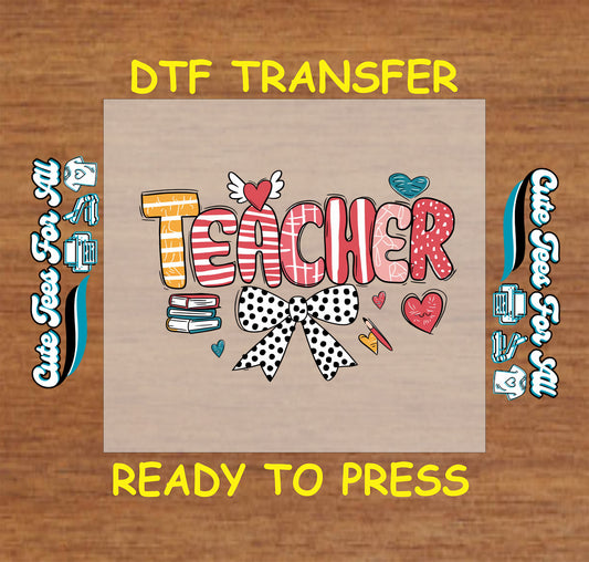 DTF transfer with patterned "Teacher" text, polka dot bow, books, and hearts.