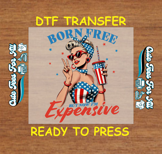 Patriotic DTF transfer with retro pin-up girl, flag outfit, drink, and “Born Free But Now I'm Expensive” quote.