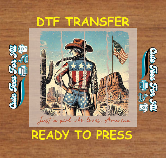 Patriotic cowgirl DTF transfer with American flag outfit, desert background, and text Just a Girl Who Loves America.
