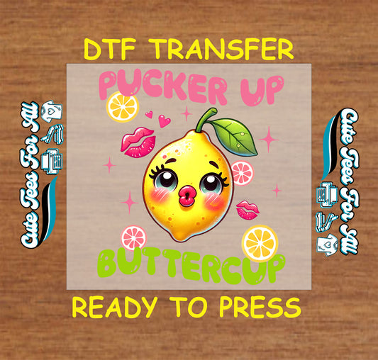 DTF transfer with cartoon lemon face, kiss marks, and the phrase "Pucker Up Buttercup"