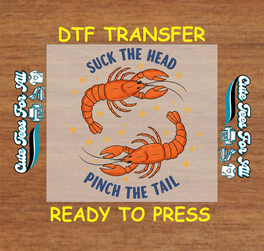 DTF transfer with two red crawfish and the quote “Suck the Head, Pinch the Tail”
