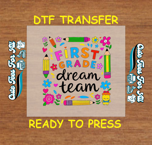 Colorful DTF transfer with “First Grade Dream Team” text, pencils, flowers, and hearts.