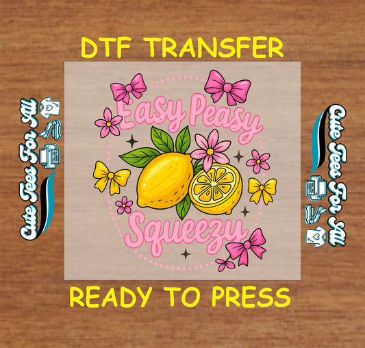 DTF transfer with lemons, pink bows, flowers, and the phrase “Easy Peasy Squeezy” in playful font.