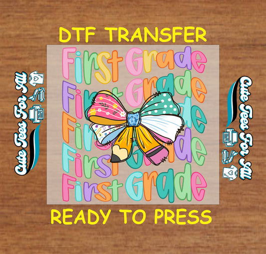 First Grade DTF transfer with repeated colorful text and large patterned bow in the center.