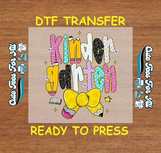 Kindergarten DTF transfer with yellow pencil bow, bold letters, flowers, and notebook graphics.
