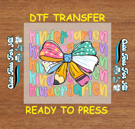 Kindergarten DTF transfer with rainbow text background and large patterned school bow.