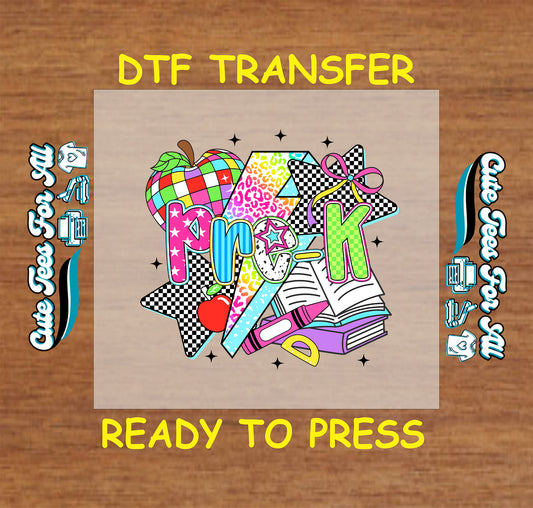 Pre-K DTF transfer with rainbow apple, bold letters, books, glue stick, stars, and school icons.
