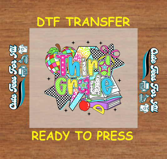 Third Grade DTF transfer with bold text, checkered stars, rainbow apple, books, and pencil.