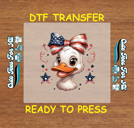 Patriotic duck DTF transfer with red, white, and blue bow and stars.