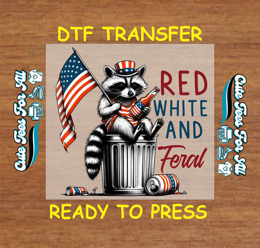 DTF transfer with raccoon in patriotic outfit holding flag and bottle, “Red White and Feral” text.