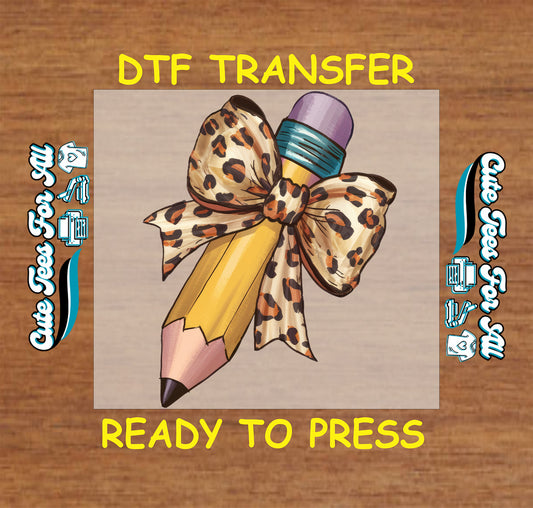 DTF transfer with yellow pencil and large leopard print bow tied at the top.