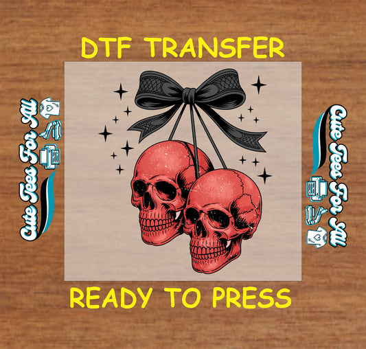 Two red skulls tied with black bow and surrounded by black stars Halloween DTF transfer

