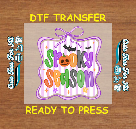 Spooky Season text with bats and bow in purple striped frame on Halloween DTF transfer

