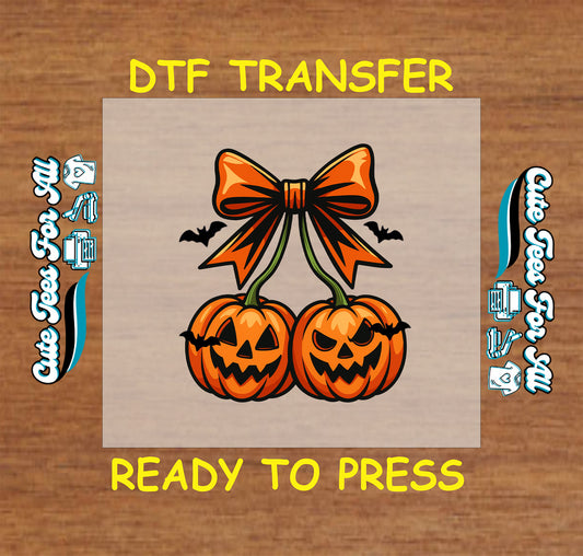 Two jack-o'-lanterns tied with orange bow and bats flying around on Halloween DTF transfer

