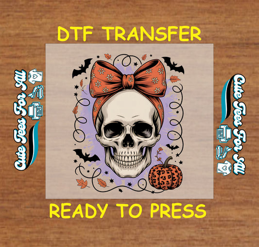 Skull with orange bow and leopard pumpkin surrounded by bats and stars, Halloween DTF transfer

