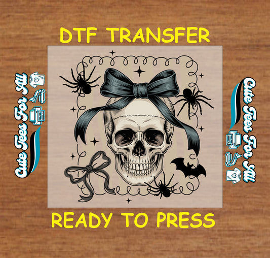 Skull with black bow surrounded by spiders, bats, and stars, Halloween DTF transfer

