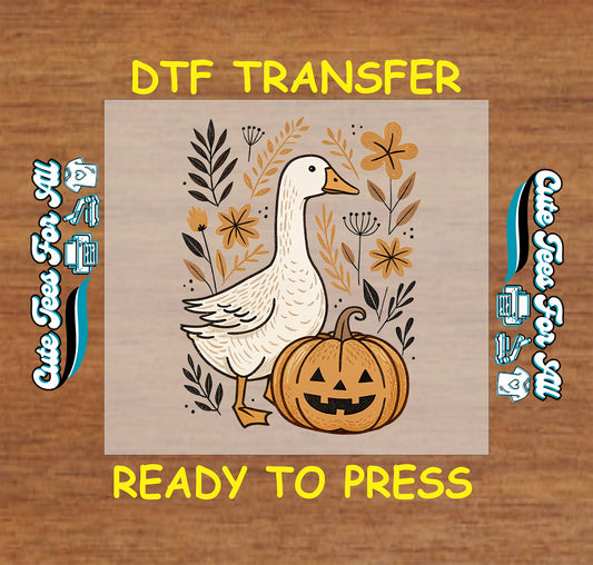 Goose beside carved pumpkin surrounded by fall florals and leaves, Halloween DTF transfer

