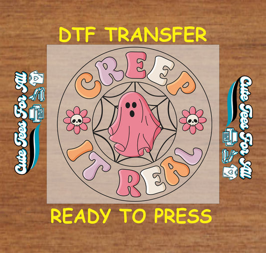 Halloween DTF transfer with “Creep It Real” text, pink ghost, spiderweb, and skull flowers in pastel tones

