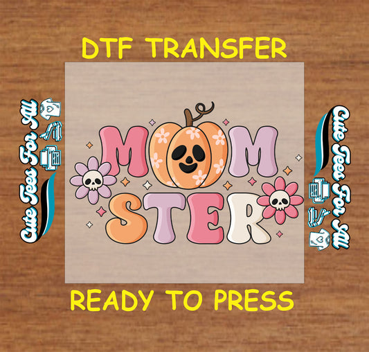 DTF transfer with pastel “Momster” text, pumpkin face, flower skulls, and sparkles

